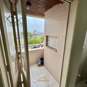 Apartamento com 65m², 2 dormitórios, 1 vaga no Edifício Porto Seguro em Torres para Comprar