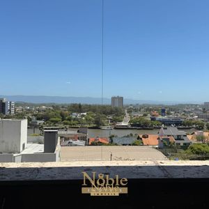 Apartamento com 108m², 3 dormitórios, 1 suíte, 2 vagas no Sun Haus em Torres para Comprar