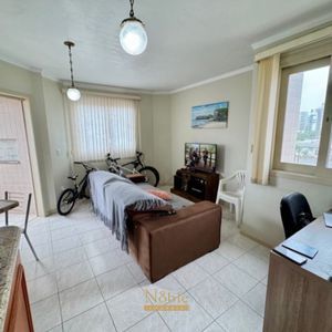 Apartamento com 65m², 2 dormitórios, 1 vaga no Edifício Porto Seguro em Torres para Comprar