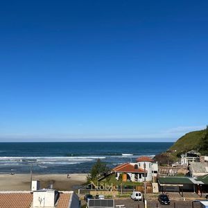 Apartamento com 74m², 2 dormitórios, 1 suíte, 2 vagas no Essenza em Torres para Comprar