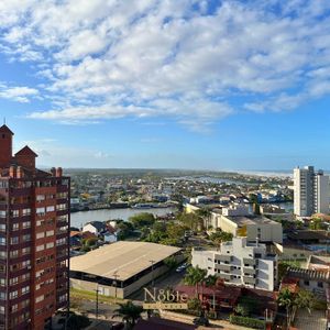 Apartamento com 91m², 2 dormitórios, 2 suítes, 2 vagas no Toronto em Torres para Comprar