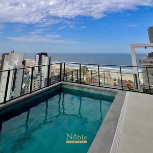 Apartamento com 102m², 3 dormitórios, 1 suíte, 2 vagas no Maui Residencial em Torres para Comprar