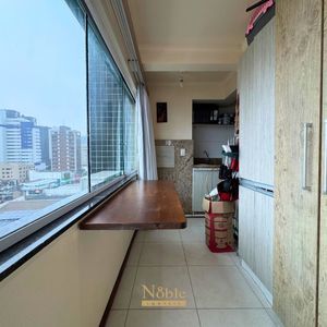 Apartamento com 91m², 2 dormitórios, 1 suíte, 1 vaga no Ed. Fenix Center em Torres para Comprar