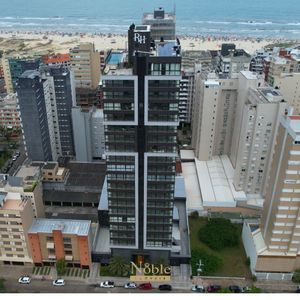 Apartamento com 102m², 3 dormitórios, 1 suíte, 2 vagas no Maui Residencial em Torres para Comprar