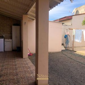 Casa com 180m², 5 dormitórios, 1 suíte, 2 vagas no bairro Praia da Cal em Torres para Comprar