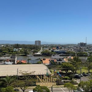 Apartamento com 108m², 3 dormitórios, 1 suíte, 2 vagas no Sun Haus em Torres para Comprar