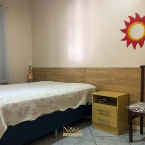 Casa com 180m², 5 dormitórios, 1 suíte, 2 vagas no bairro Praia da Cal em Torres para Comprar