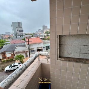 Apartamento com 65m², 2 dormitórios, 1 vaga no Edifício Porto Seguro em Torres para Comprar