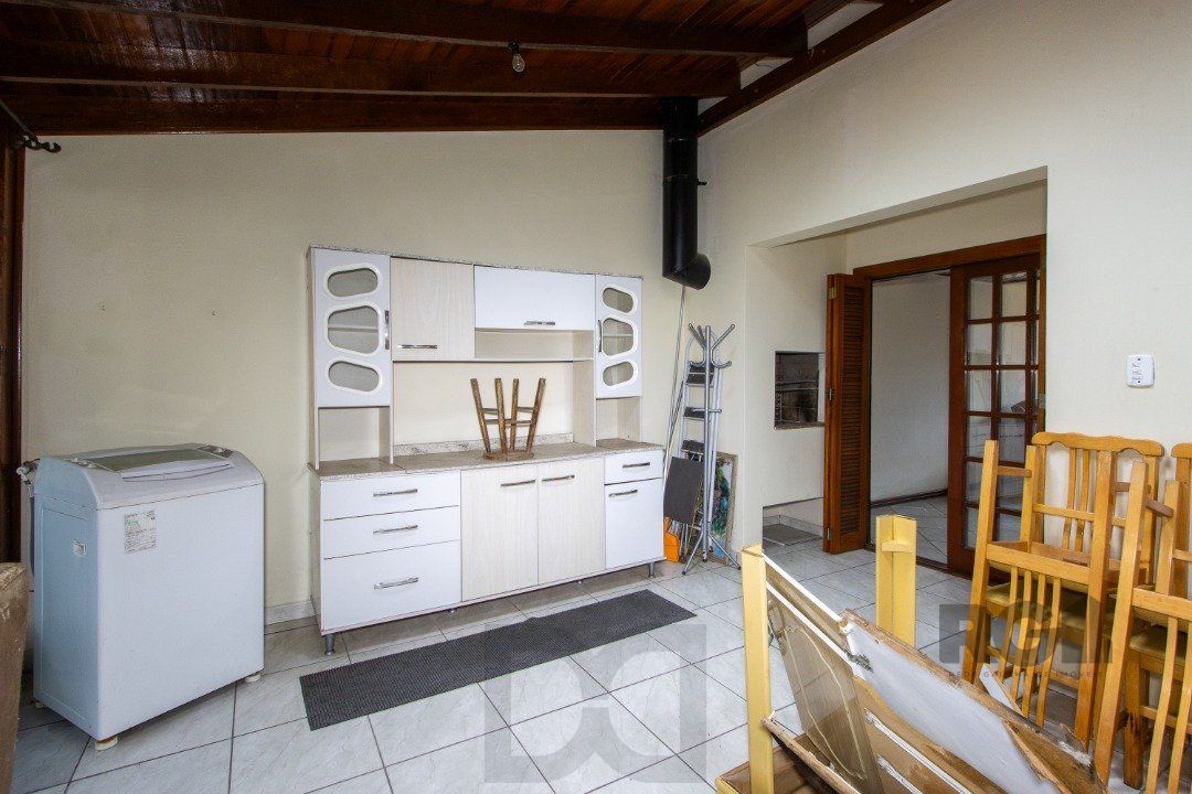 Casa em Condomínio na Zona Sul, no bairro Hípica, com 2 dormitórios, living para dois ambientes, cozinha mobiliada, lavabo — foto 16