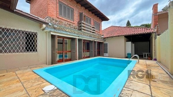 Casa em Porto Alegre, no bairro Guarujá, com 5 dormitório(s), e 5 banheiros, à venda. — foto 32