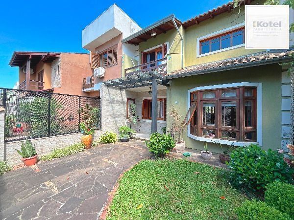 Casa em Porto Alegre, no bairro Hípica, com 3 dormitório(s), e 2 banheiros, à venda. — foto 2