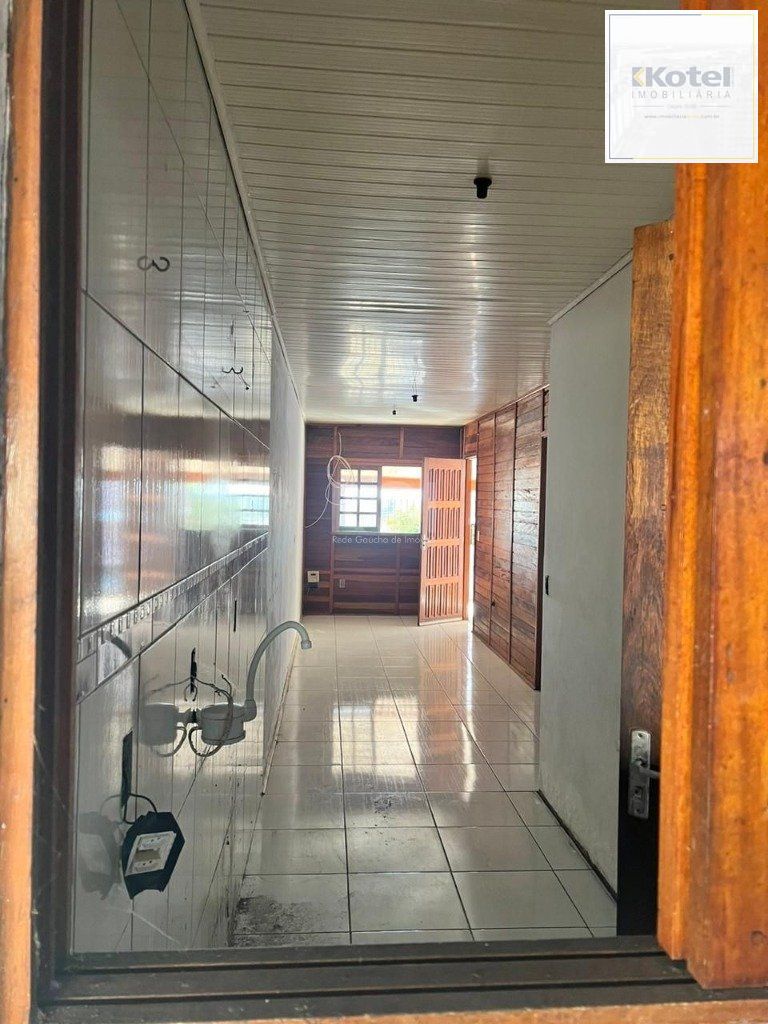 Terreno de 392m² com casa mista de 82m²