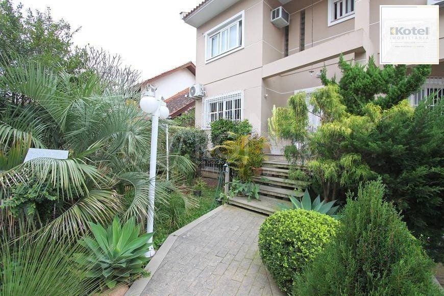 EXCELENTE CASA COM 4 DORMITÓRIOS, 6 VAGAS DE GARAGEM E VISTA PANORÂMICA. — foto 2