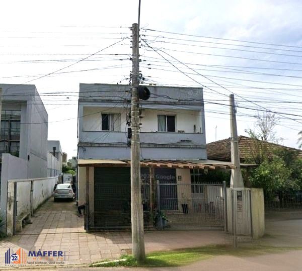 Prédio comercial e residencial no bairro Niterói com loja e apartamento