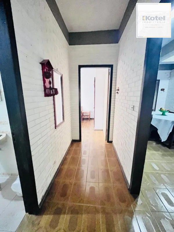 corredor para os quartos de baixo