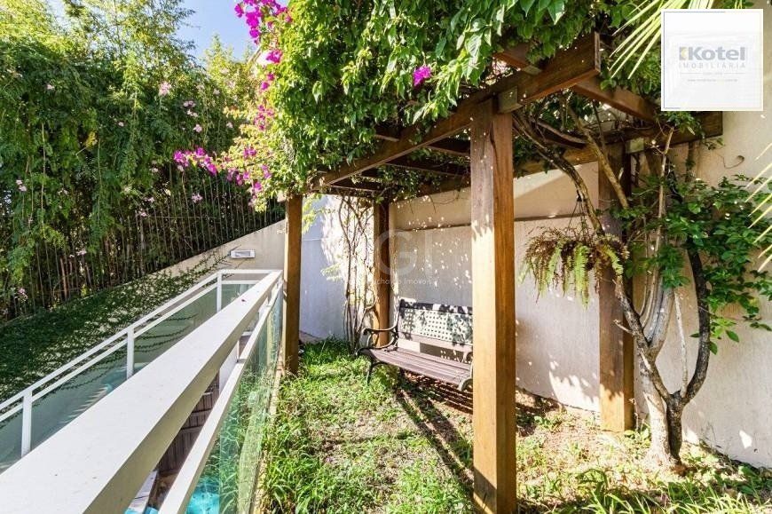 Excelente casa de 264m² com 4 dormitórios no bairro Menino Deus — foto 5