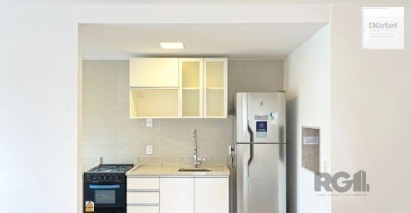 Apartamento no bairro Auxiliadora de 2 dormitórios vaga e infra DESOCUPADO — foto 5