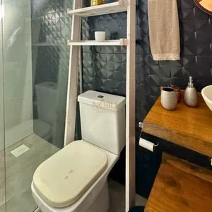 Casa com 108m², 2 dormitórios, 2 vagas no bairro Capão do Cravo em Passo de Torres para Comprar