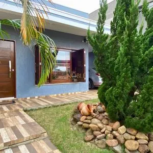 Casa com 148m², 3 dormitórios, 1 suíte, 2 vagas no bairro Morada das Palmeiras em Torres para Comprar