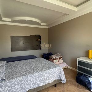 Sobrado com 290m², 4 dormitórios, 1 suíte, 2 vagas no bairro Igra Norte em Torres para Comprar