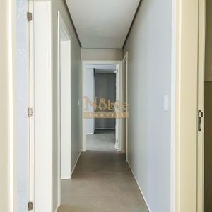 Apartamento com 119m², 3 dormitórios, 1 suíte, 2 vagas no Titanium em Torres para Comprar
