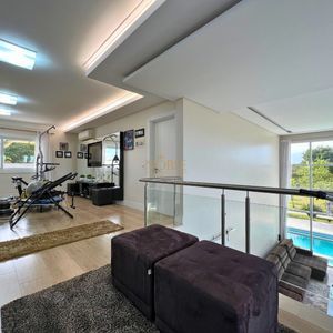 Casa com 600m², 4 dormitórios, 1 suíte, 4 vagas no bairro Igra Norte em Torres para Comprar