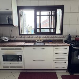 Casa com 252m², 5 dormitórios, 1 suíte, 2 vagas no bairro Centro em Torres para Comprar