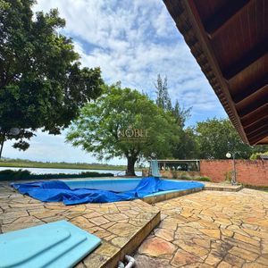 Casa com 220m², 4 dormitórios, 4 suítes, 2 vagas no bairro Igra Norte em Torres para Comprar