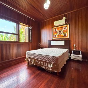 Casa com 220m², 4 dormitórios, 4 suítes, 2 vagas no bairro Igra Norte em Torres para Comprar