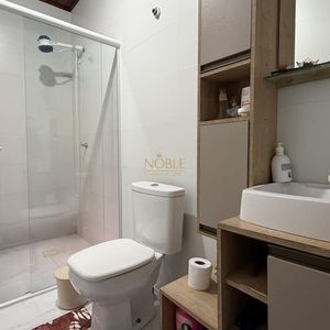 Casa com 136m², 3 dormitórios, 1 suíte, 2 vagas no bairro Praia da Cal em Torres para Comprar