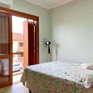 Casa com 272m², 4 dormitórios, 1 suíte, 3 vagas no bairro Igra Norte em Torres para Comprar