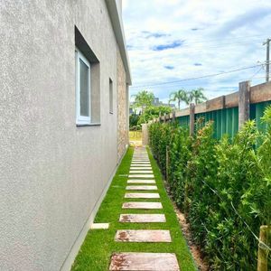 Casa de Condomínio com 180m², 4 dormitórios, 4 suítes, 2 vagas no Condomínio Ilhas Park em Torres para Comprar