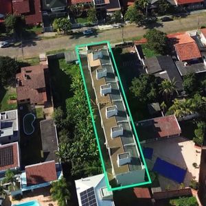 Sobrado com 127m², 3 dormitórios, 1 suíte, 1 vaga no Ilhas Travertino em Torres para Comprar