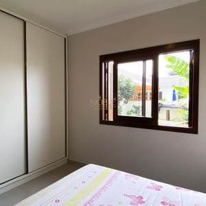 Casa com 100m², 2 dormitórios, 1 suíte, 2 vagas no bairro Bella Torres em Passo de Torres para Comprar