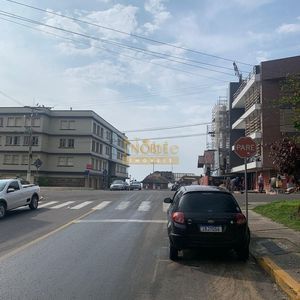 Apartamento com 68m², 3 dormitórios, 1 vaga no ed.caeté em Torres para Comprar