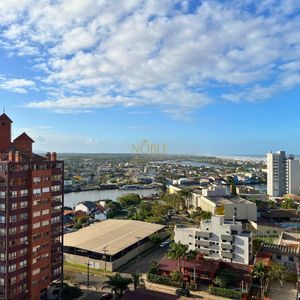 Apartamento com 91m², 2 dormitórios, 2 suítes, 2 vagas no Toronto em Torres para Comprar