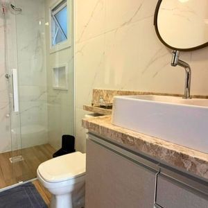 Casa com 120m², 3 dormitórios, 1 suíte, 2 vagas no bairro Loteamento Caravelle em Passo de Torres para Comprar