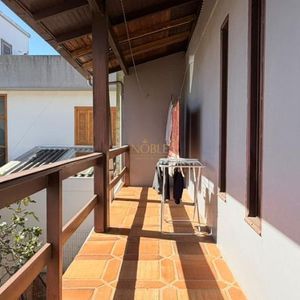 Casa com 228m², 3 dormitórios, 1 suíte, 2 vagas no bairro Stan em Torres para Comprar