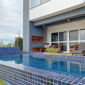 Casa de Condomínio com 330m², 3 dormitórios, 3 suítes, 2 vagas no Reserva das Águas em Torres para Comprar