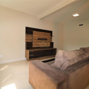 Sobrado com 220m², 5 dormitórios, 4 suítes, 3 vagas no bairro Stan em Torres para Comprar