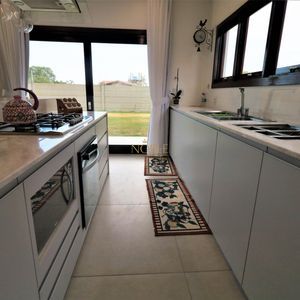 Casa de Condomínio com 301m², 4 dormitórios, 4 suítes, 2 vagas no Reserva das Águas em Torres para Comprar