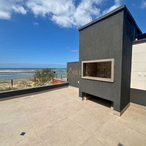 Casa com 272m², 3 dormitórios, 3 suítes, 4 vagas no bairro Itapeva em Torres para Comprar