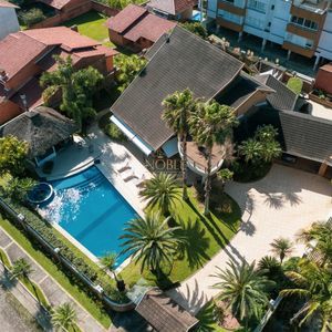 Casa, 4 dormitórios, 2 suítes, 3 vagas no bairro Praia Grande em Torres para Comprar