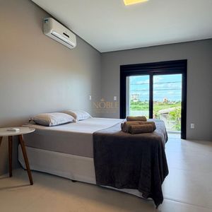 Casa, 2 dormitórios, 2 suítes, 1 vaga no bairro Morada das Palmeiras em Torres para Comprar