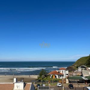 Apartamento com 74m², 2 dormitórios, 1 suíte, 2 vagas no Essenza em Torres para Comprar