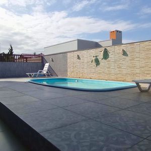 Casa com 500m², 4 dormitórios, 4 suítes, 2 vagas no bairro Bella Torres em Passo de Torres para Comprar