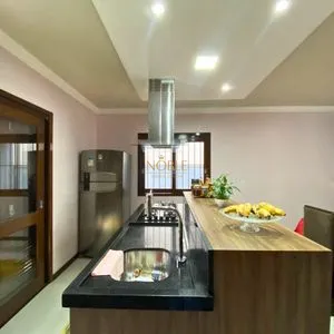 Casa com 148m², 3 dormitórios, 1 suíte, 2 vagas no bairro Morada das Palmeiras em Torres para Comprar