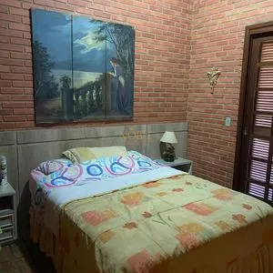 Casa com 247m², 5 dormitórios, 3 suítes, 3 vagas no bairro Praia Grande em Torres para Comprar