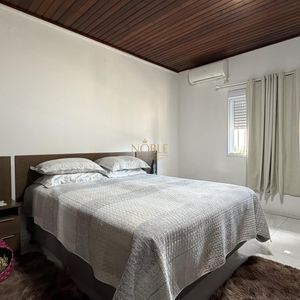 Casa com 136m², 3 dormitórios, 1 suíte, 2 vagas no bairro Praia da Cal em Torres para Comprar