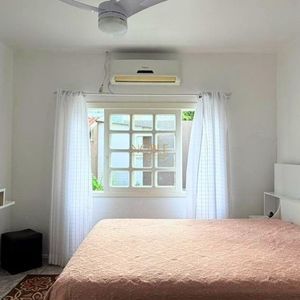 Casa com 171m², 4 dormitórios, 3 vagas no bairro Porto Alegre em Torres para Comprar